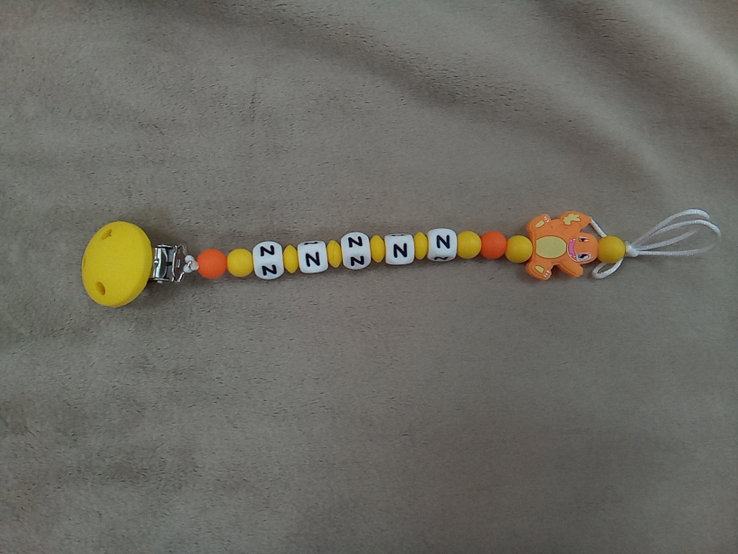 Attache sucette silicone dragon jaune à personnaliser